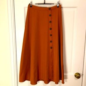 Burnt orange midi skirt with asymmetrical buttons